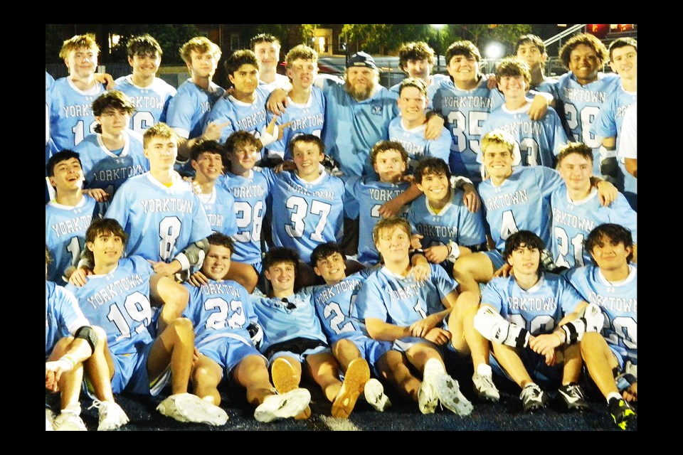 Yorktown High School head boys lacrosse coach Greg Beer, middle back row, won his 200th career game when the Patriots defeated host Washington-Liberty on April 29. He became Yorktown's head coach in 2006.