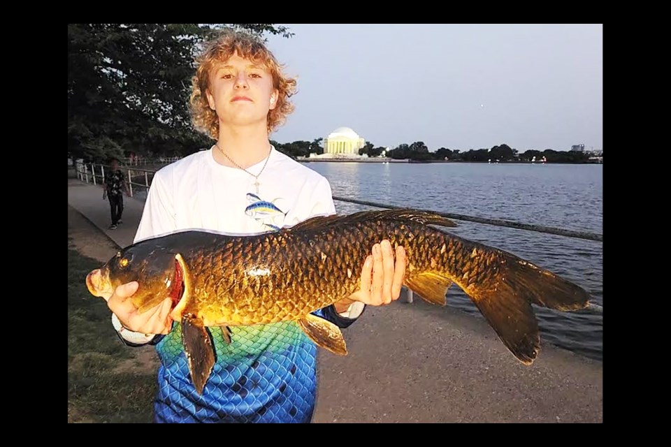Kasper Parformak with his record-catching carp fish.