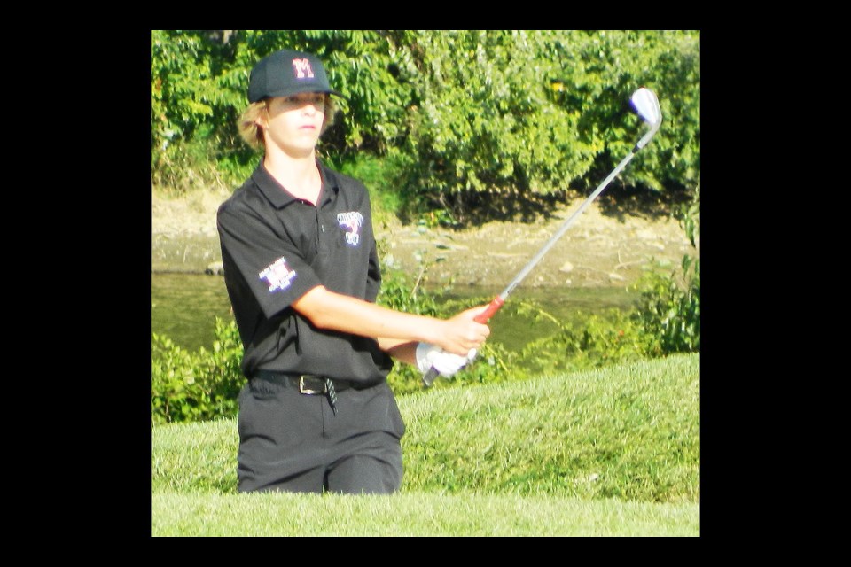 Madison golfer Ryan Moseley hits out of a sandtrap on the 18th hole during his final round of the Concorde District golf tournament.