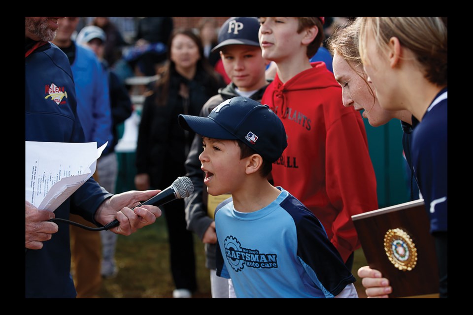 At the end of the McLean Little League opening-day ceremony, “Play Ball” was called by Tre Santiago (center) Dylan Baldrate, Reid Merson, Catherine Stallmer and Katie Ockerman.