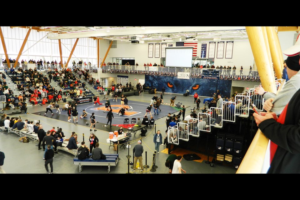 Many spectators watched the state-tournament wrestling action in the Spangler Center from above.