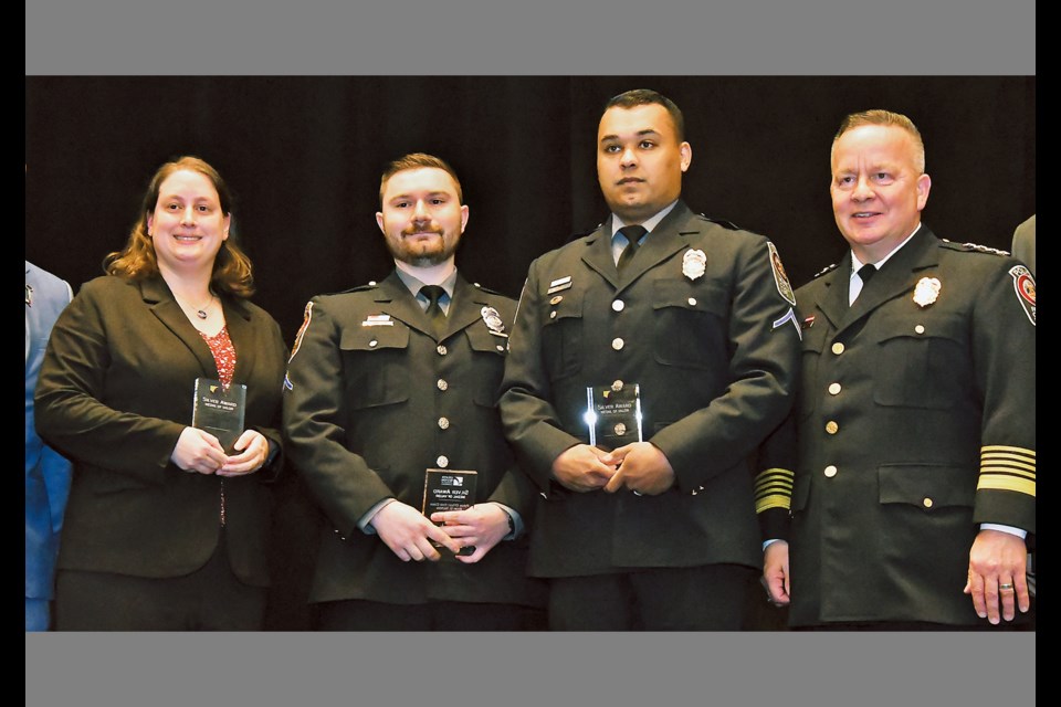 Fairfax County police Pfcs. Kristen Rowe, Brian Nichols and Nathan Doehnert received Silver Medals of Valor April 11, 2024, at the 46th annual Fairfax County Valor Awards, held at the Hyatt Regency Reston. Pictured with them is Fairfax County Police Chief Kevin Davis (right). The officers were honored for rescuing a driver from an overturned sport-utility vehicle that had caught fire. 

