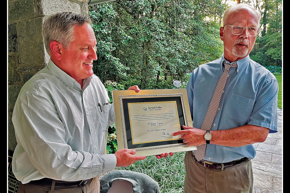 Great Falls Citizens Association president Christopher Rich (left) presents his predecessor, William Canis, with the group's Glen Sjoblom Award during a June 28, 2023 ceremony. 
