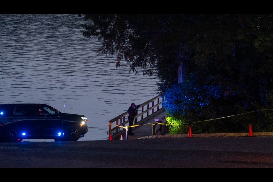 A police officer takes evidence on Saturday evening. 