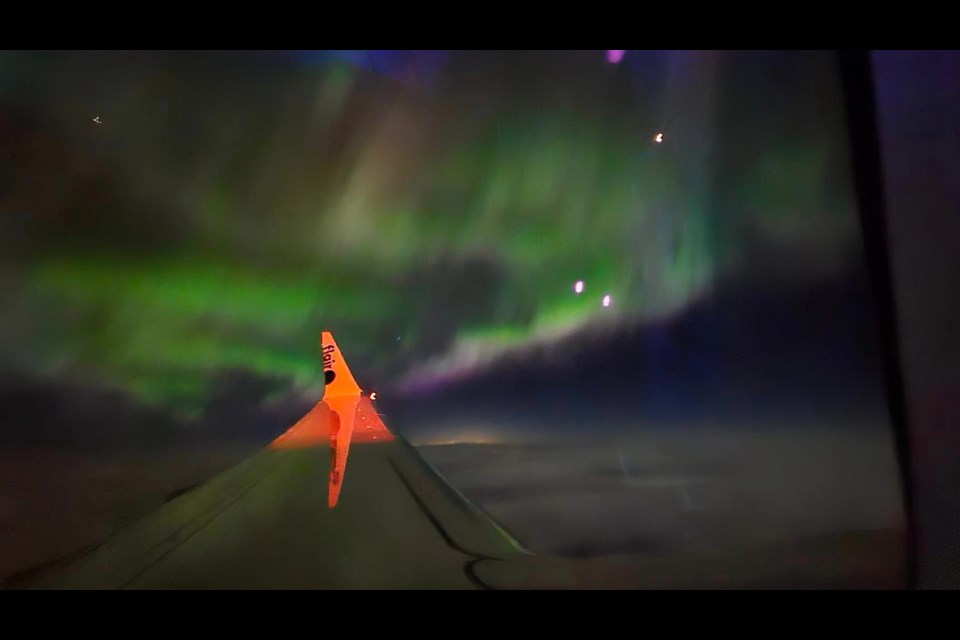 A woman was flying over B.C. when she caught a glimpse of the northern lights on Feb. 26, 2023. 