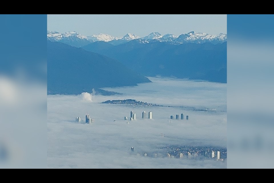 Lawrence Hogarth was flying over Vancouver when he witnessed dense fog over the city.