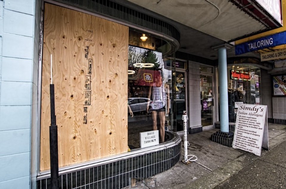 One of Davie Village Tanning salon's windows was boarded up in early February.