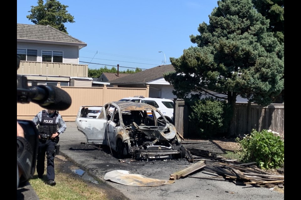 The burned-out car police found in Newton, Surrey.