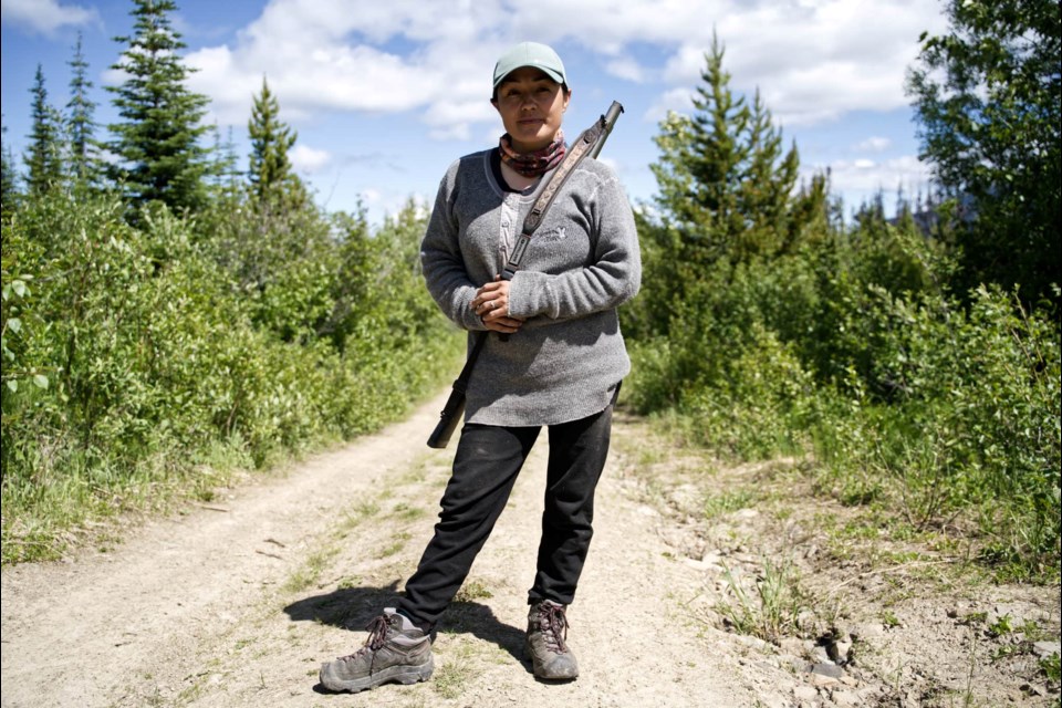 Saulteau First Nations caribou guardian Starr Gauthier works on behalf of the Saulteau and West Moberly First Nations to provide around-the-clock armed security for endangered B.C. caribou in an enclosed maternity pen. Guardians protect the mother caribou and calves from predators and also hand-forage lichen to feed the captive animals.