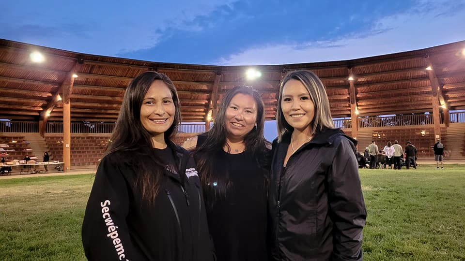 Left to right: Jessika K. Myers, MorningStar Peters and Nikki Fraser at the Tk’emlúps te Secwépemc Powwow Arbour, where they have served over 2,750 meals and provided a culturally safe and trauma-informed environment for the evacuees.