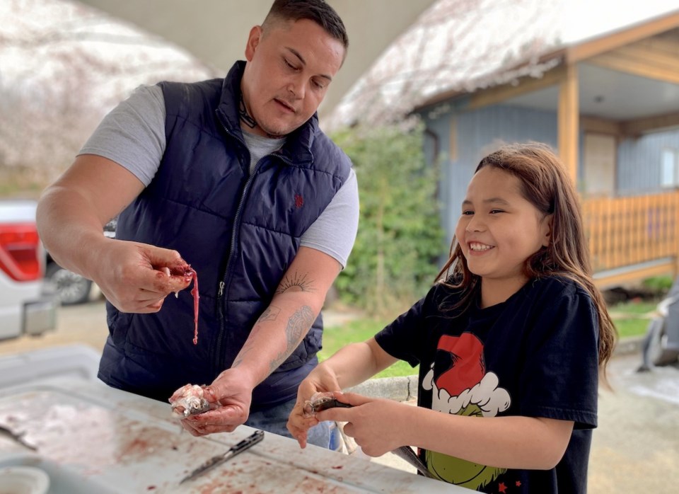 joshua_charleson_and_kinsley_prepping_herring