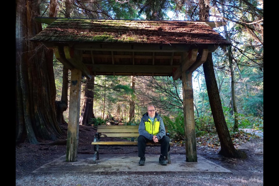 Tim Chisholm sits on the Stanley Park memorial bench to Aaron Webster, who was killed by swarming teens in 2001. Webster died in Chidholm's arms.