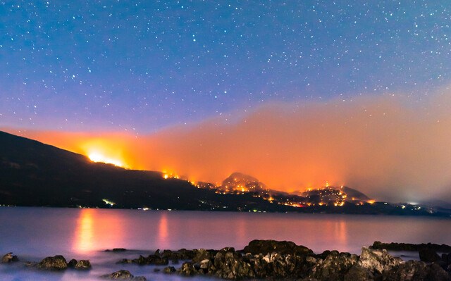 The White Rock Lake fire burning above Westside Road on the evening of Aug. 7.