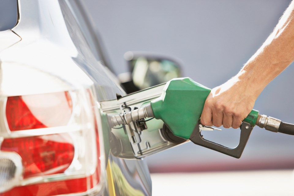 man pumps gas