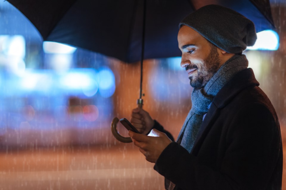 manwithumbrellaraining