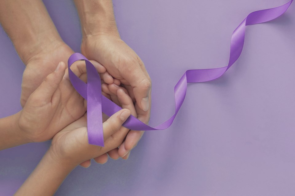purple ribbon hands
