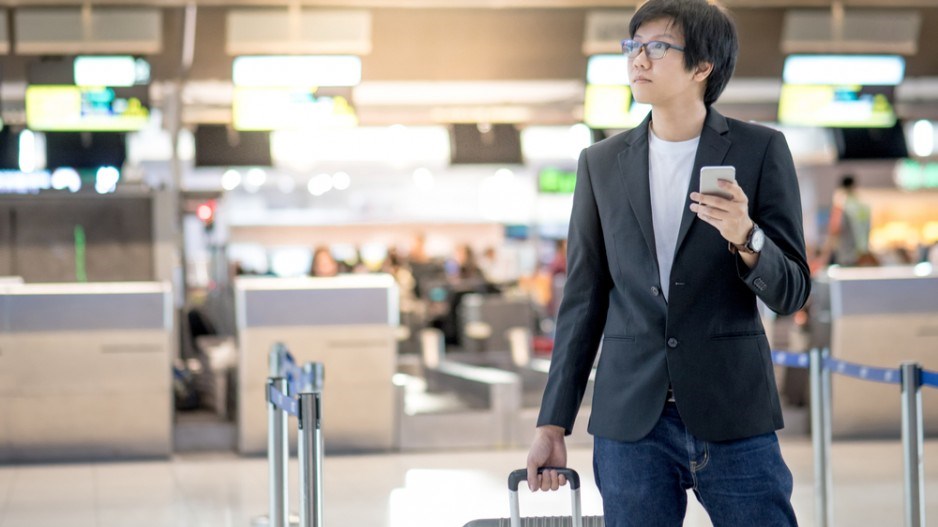 business_person_phone_airport_shutterstock