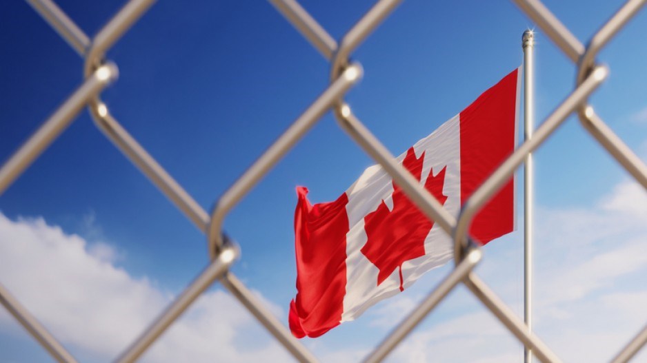 canada-flag-fence-istock