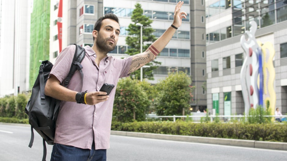 man_hailing_uber_credit_shutterstock