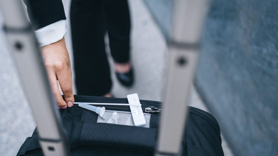 woman-gets-coronavirus-testing-kit-travel