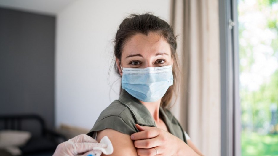 woman-mask-vaccine-getty-halfpoint-images