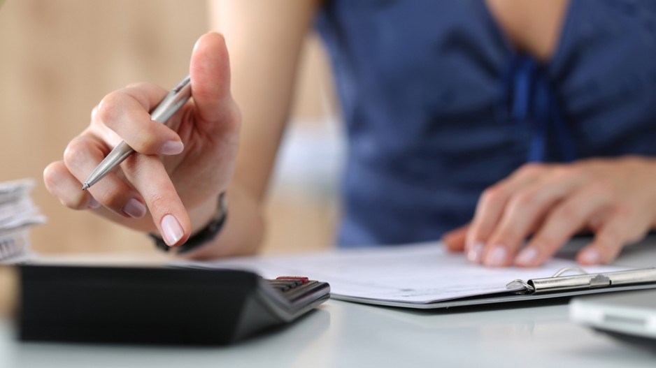 woman_hand_calculator_shutterstock