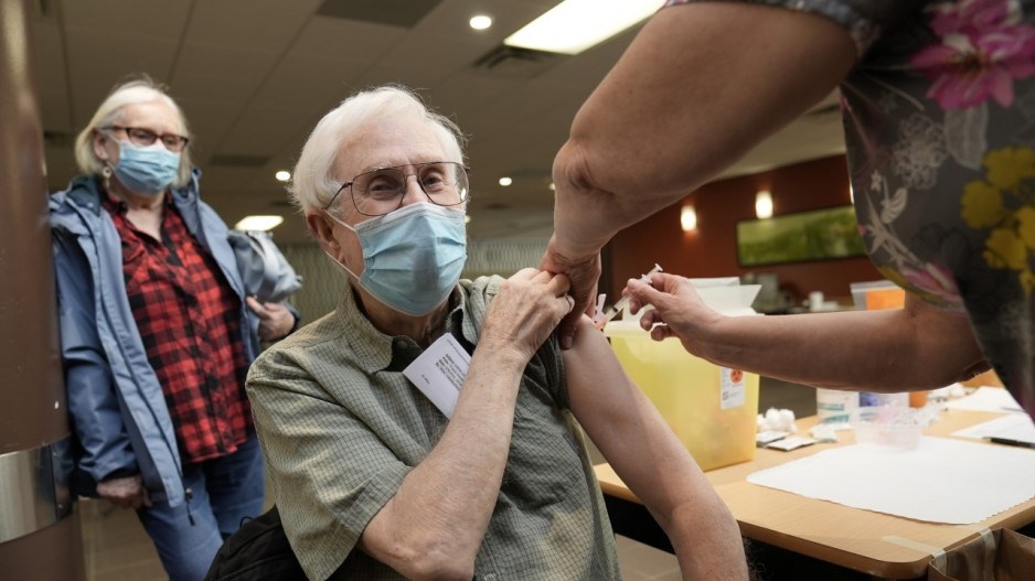 cathy-and-alex-burton-get-their-covid-shots-vaccination-clinic-douglas-college-credit-fraser-health