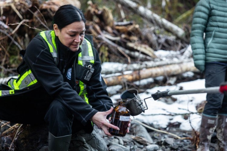 Researchers from an environmental group and local First Nations collect water samples near Sumas Prairie, B.C., in the months after floods hit the region. Alex Harris/Raincoast Conservation Foundation