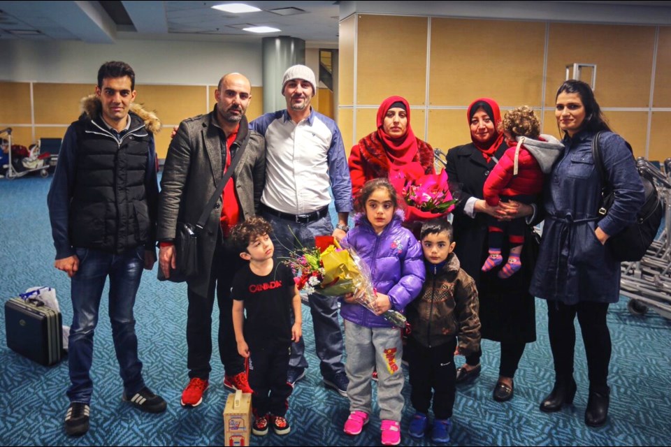 The Ali family safe and united, at the Vancouver International Airport on March 2.