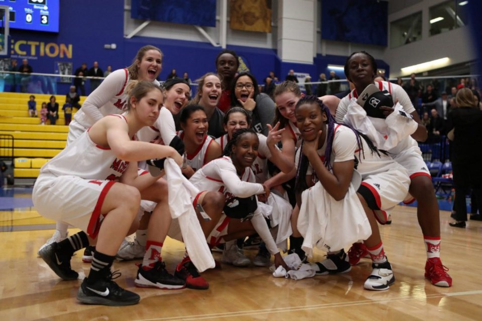 McGill Martlets celebrate after winning the Canadian university women's basketball championship