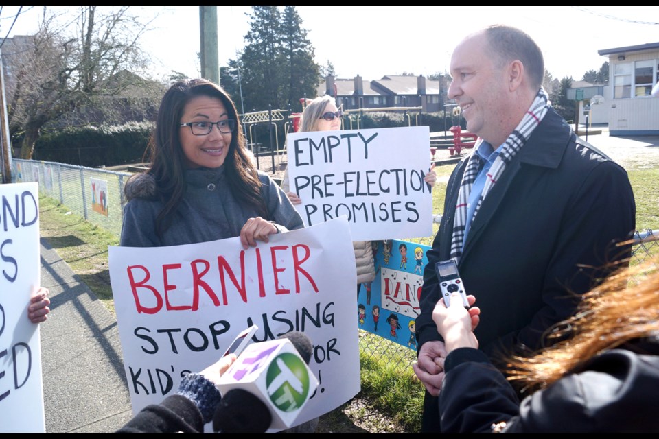 Seismic school upgrades advocate and Richmond parent Kim Nowitsky confronted B.C.’s Education Minister Mike Bernier outside Cook elementary, after he announced $14 million in upgrades for the school, including a four-classroom expansion.