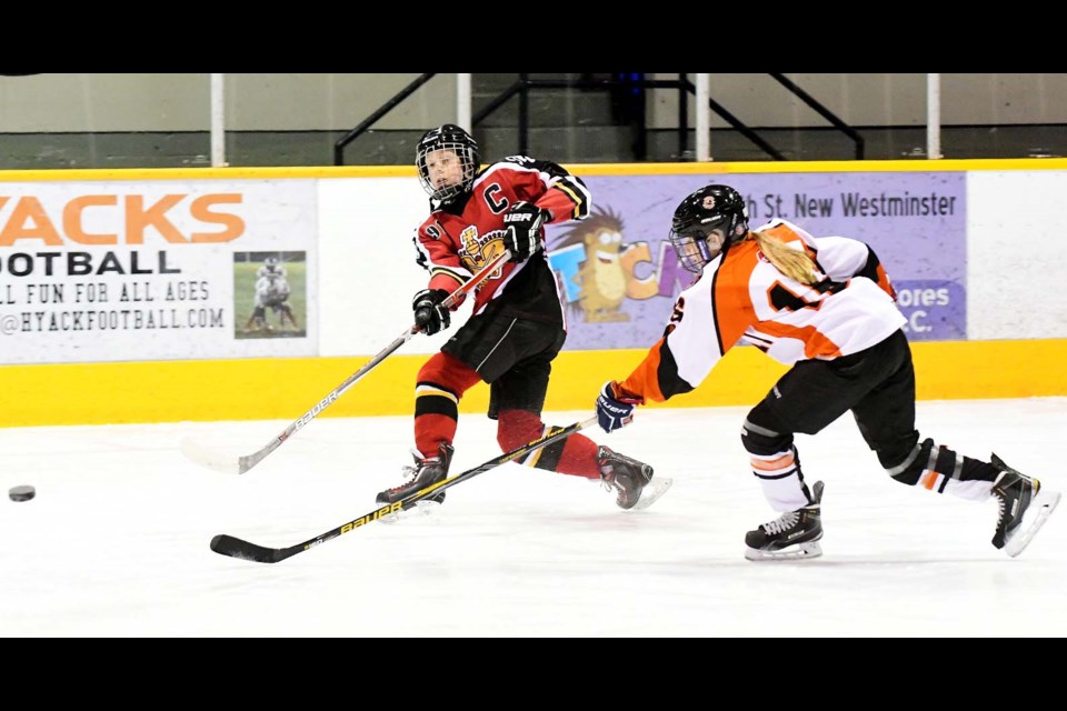 Firing a shot on goal during round-robin action against Semiahmoo is New Westminster Royals captain Colburn Connelly at the Bobby Love Memorial atom hockey tournament at Queen's Park Arena.