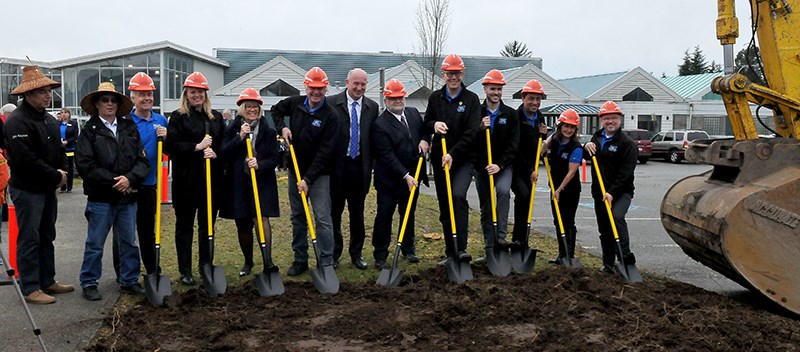 Port Coquitlam city council, MP Ron McKinnon, MLA Mike Farnworth, UBCM's Wendy Booth and council members with the Kwikwetlem First Nation turn the ground in front of the Port Coquitlam rec centre. A $132-million replacement will be complete in June 2021.