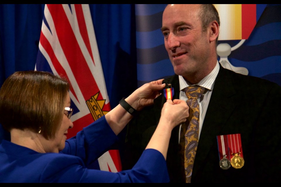 Minister of Jobs, Tourism and Skills Training Shirley Bond presents Victorian Peter Lawless with B.C.&Otilde;s newest honour, the Medal of Good Citizenship, for his advocacy of community sports.