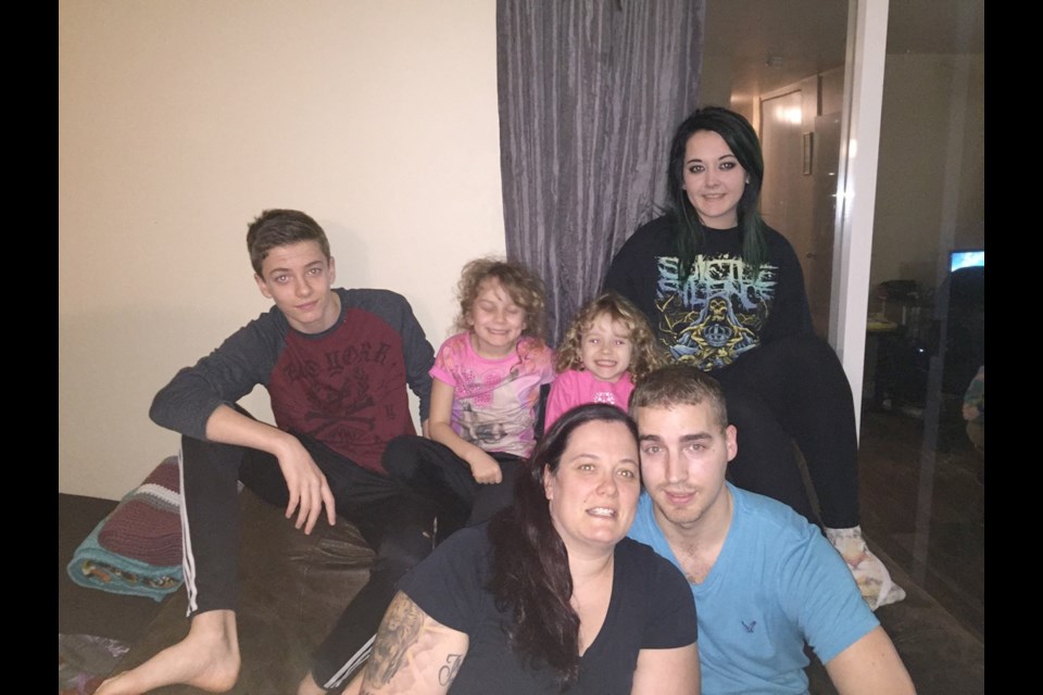Jessica Pitt with her husband, Zak Chamberlain, and their four children, from left, 16-year-old Cameron, six-year-old Miah, four-year-old Cassidy and 19-year-old Ayla. The family was displaced by the fire at Evergreen Terrace and now pays more than double the previous rent in the Tillicum area. SUBMITTED