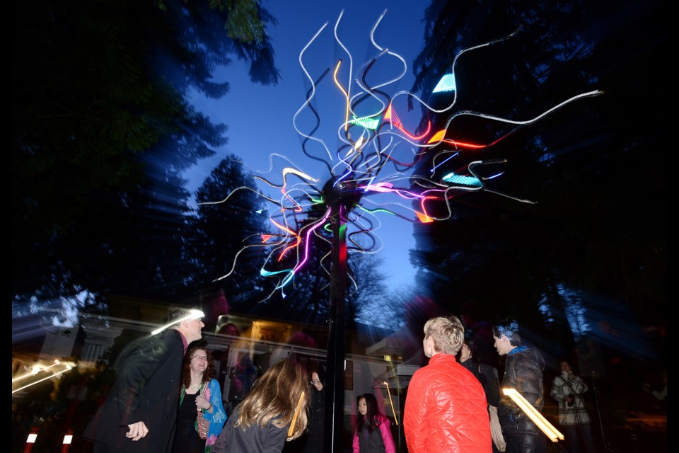 Visitors dance and jump to set Robert Turriff's Pulse Quasar in motion.