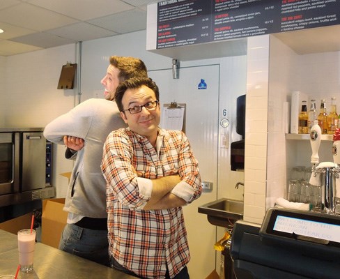 Chef Anthony Sedlak and Food Network host John Catucci ham it up for the cameras during a filming of You Gotta Eat Here! at The American Cheesesteak Co. May 4.