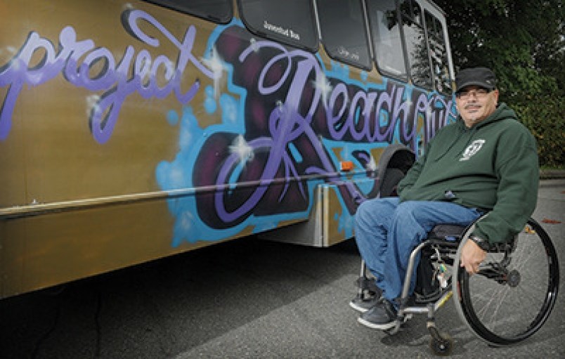 Jerome Bouvier with the Reach Out bus.