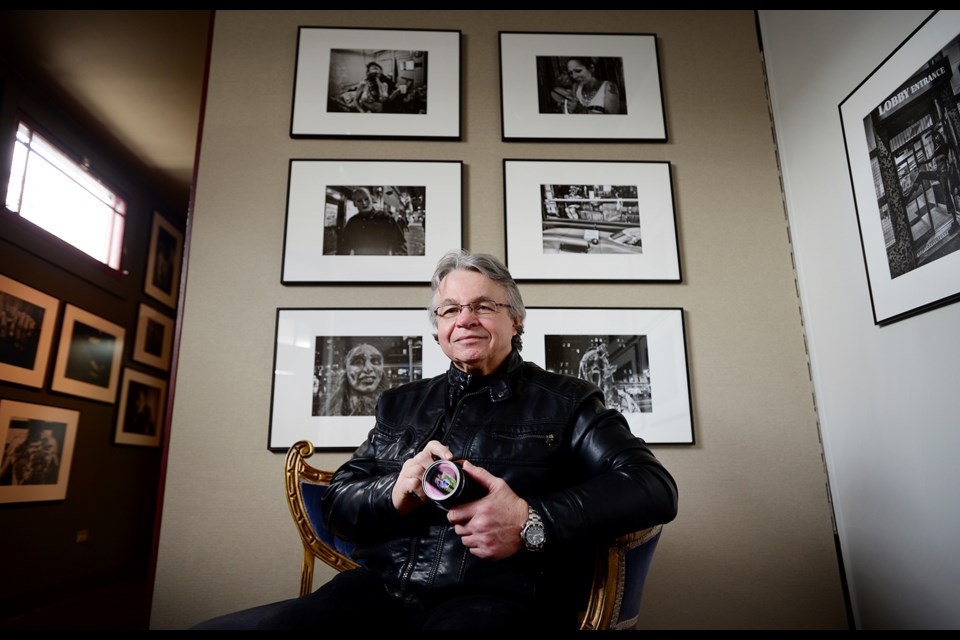 Gabor Gasztonyi with his work as his 12th Street studio and gallery. Gasztonyi's Hastings: A Second Look is running as part of the Capture Photography Festival starting in April.