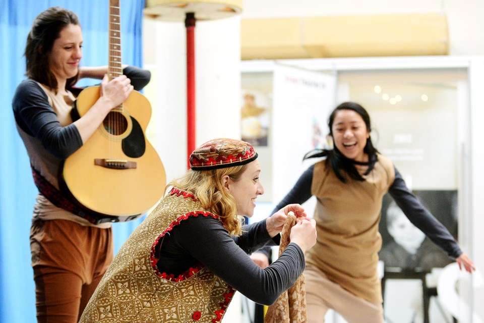 Story Theatre performs Rhymes, Reason and Rascals during an Art Starts performance at River Market.