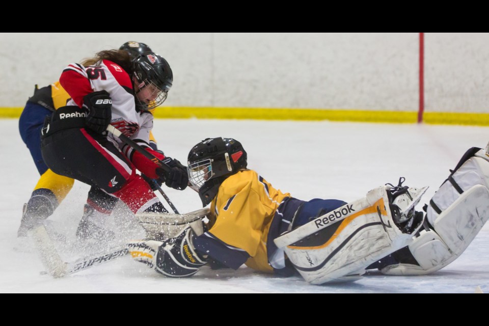 Richmond Ravens’ Katie Chan is turned back on the doorstep by Tri-Cities Predators goaltender Ashlee Van Straten during B.C. Hockey’s Bantam Girls Provincial championship game at the Richmond Ice Centre. The Ravens saw an outstanding season end in heartbreak, a 2-1 loss.