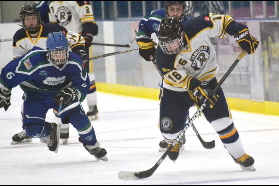 Richmond Blues' Alex Bernardini breaks towards the net during Sunday's provincial juvenile championship game at Minoru Arena. The Blues were edged 3-2 by defending champion North Vancouver.