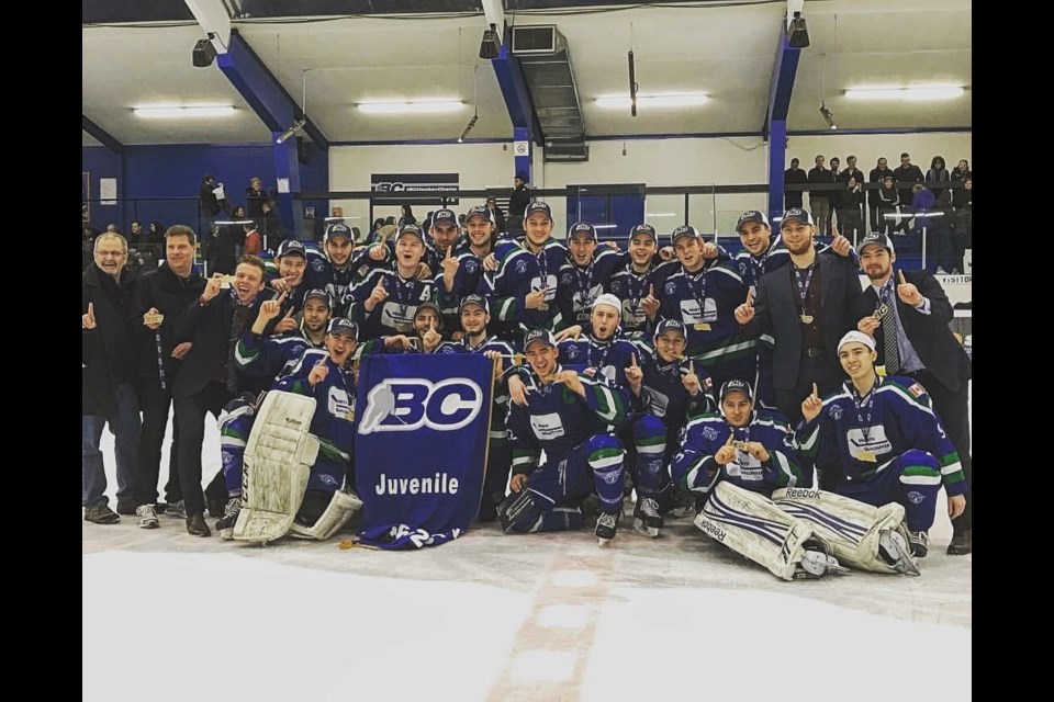 Members of the North Vancouver Storm Juvenile AAA team celebrate their second straight B.C. title after beating Richmond 3-2 Sunday at Minoru Arena in Richmond. The NVMHA team rebounded after starting the season with a 1-8-1 record. photo supplied