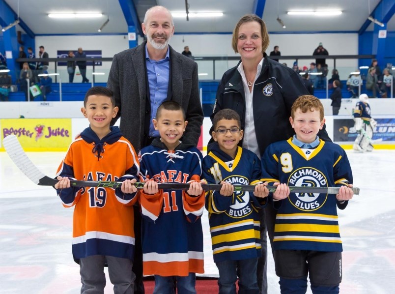 Seafair president Nigel Shackles and Richmond Minor Hockey president Carolyn Hart, pictured here with players Gavin Dacpano, D'Angelo Brual, Braelyn Nunley and Landon Ward from both local clubs, are open to the possibility of making a long-awaited merger of the rival organizations a reality.