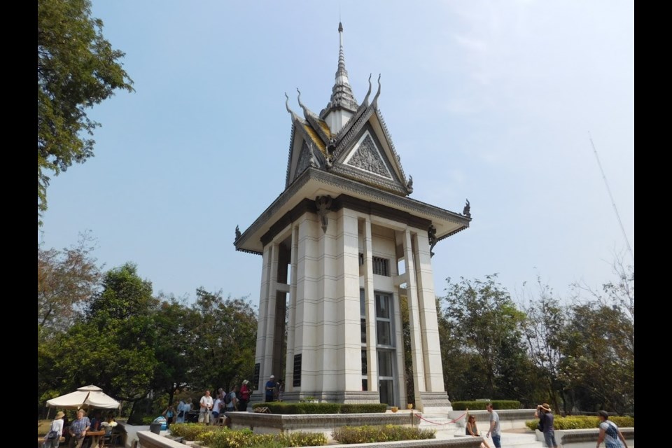 The Memorial Stupa at the Choeung Ek Genocidal Center in Phnom Penh, Cambodia holds the skulls of more than 8,000 Khmer Rouge victims. Photo Lucas Aykroyd