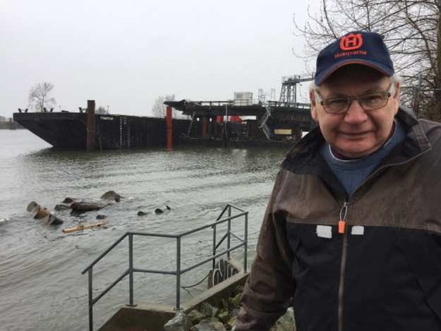 Terry Slack, a veteran gillnetter and Fraser River watchdog, next to a barge used to dump sediments at a federal marine disposal site off Point Grey near UBC. The barge is moored on the north arm of the Fraser River.