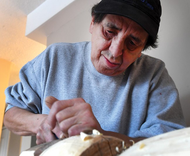 Lenard Paquette Jackson, a carver, has many projects on the go including the one he is working on here an eight-foot totem that he is looking to complete soon to honour his murdered mother's memory as well as dedicating it to all women who have been lost to violence.