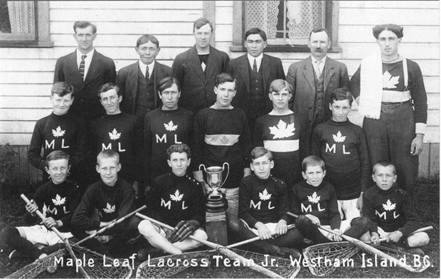 The Maple Leaf lacrosse team from Westham Island pose with a championship trophy in the fall/winter of 1913-14. Four members of the team were killed in the First World War.