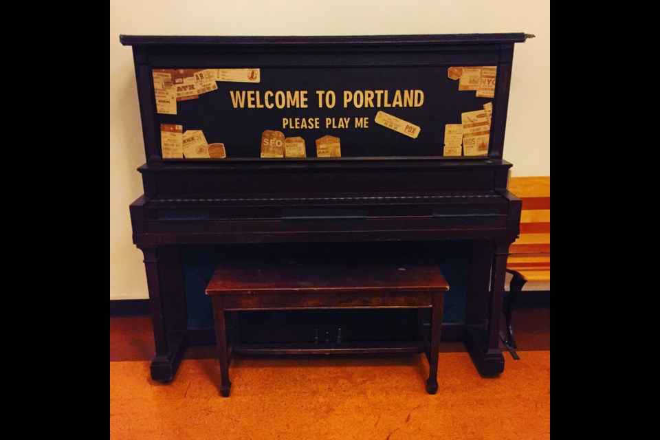 On old piano outside Revolution Hall in the hallway of Washington High School invites passersby to play. Photo Michael Kissinger