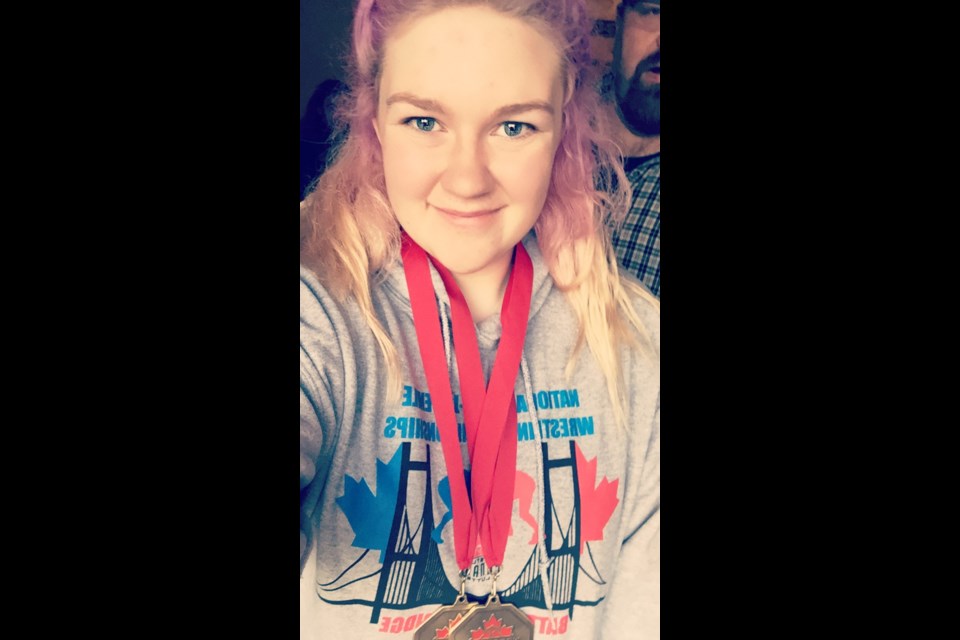 Zenze Stanley-Jones, a Grade 10 student at Kelly Road secondary school, took a selfie to show the two gold medals she won over the weekend in the 90 kg weight class at the cadet/juvenile wrestling championships in Windsor, Ont.
